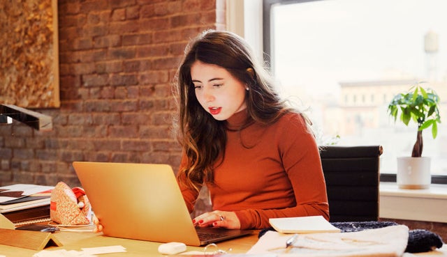 photo of a person working on a computer
