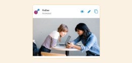 An image of two individuals working together.