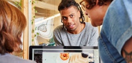 People talking over a computer
